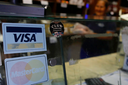 Visa и MasterCard накажут за Венесуэлу